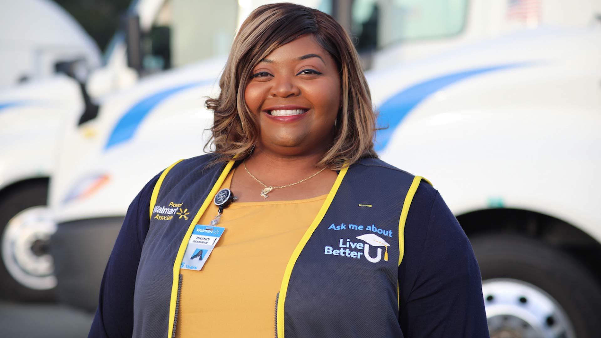 Photo of a Walmart Associate smiling at the camera.