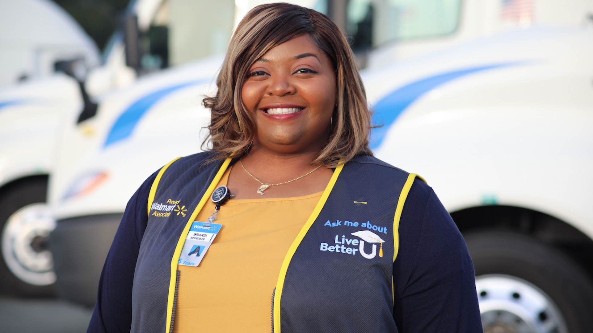 Photo of a Walmart Associate smiling at the camera.