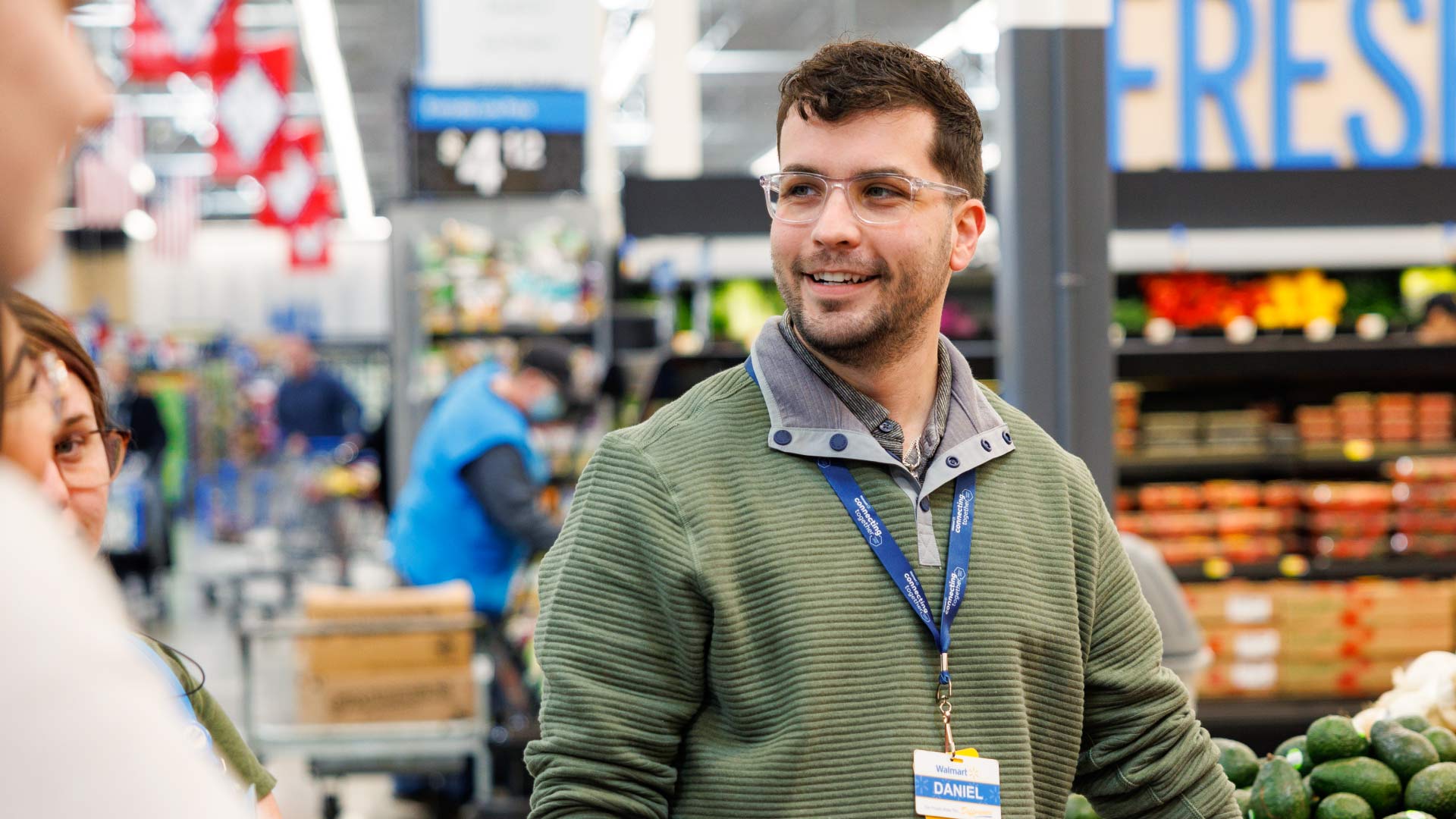 Photo of a Walmart Associate smiling at the camera.